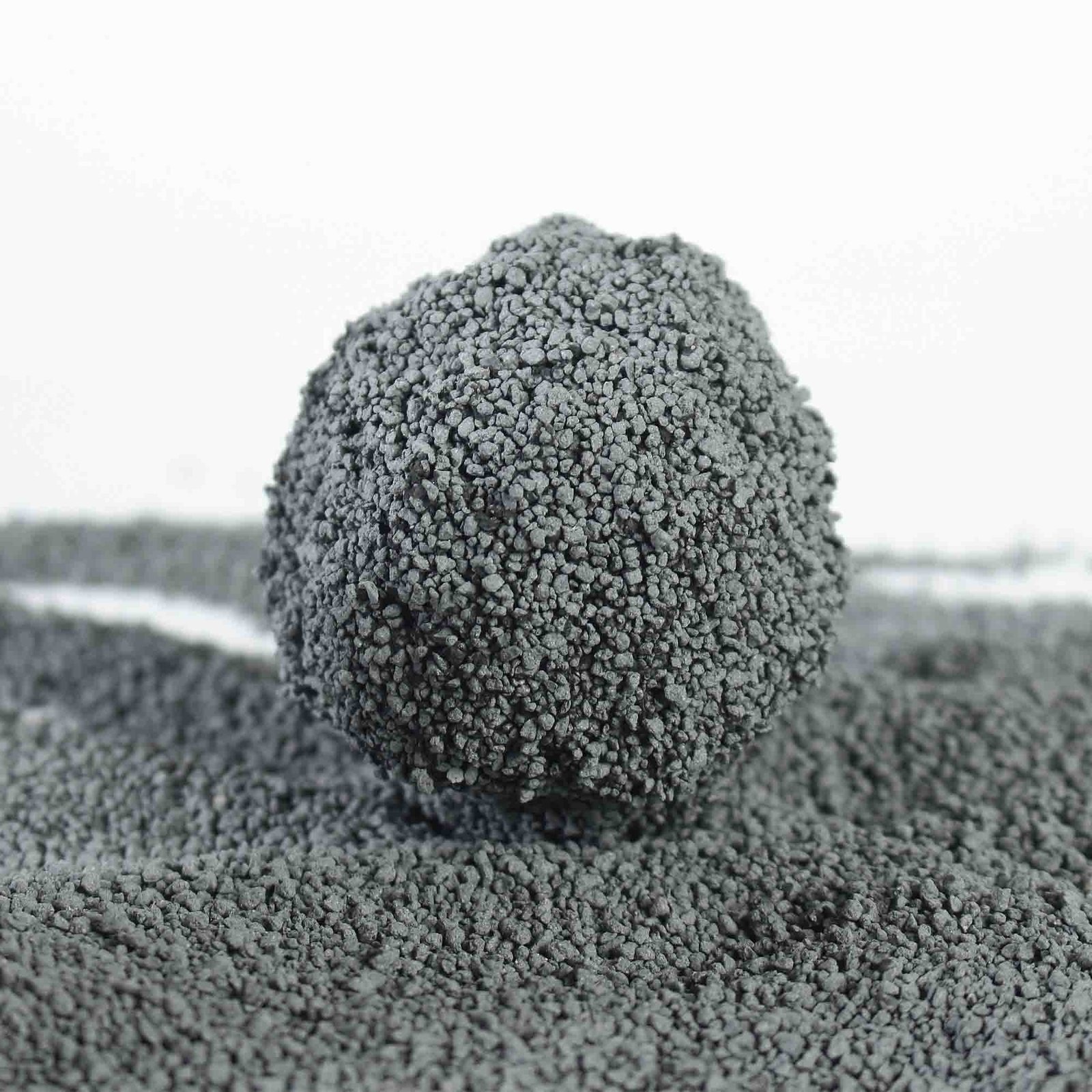 crushed carbon bentonite cat litter with irregular black carbon particles